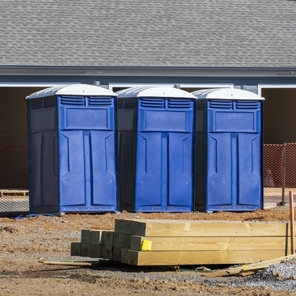 what is the cost difference between standard and deluxe portable restroom rentals in Bear